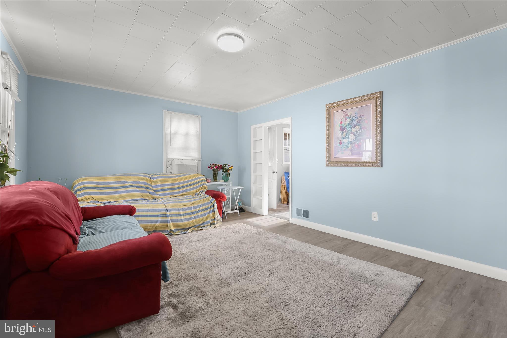 2813 Oak Grove Avenue Halethorpe, MD 21227 - Photo 3 of 43 a bedroom with furniture and a couch