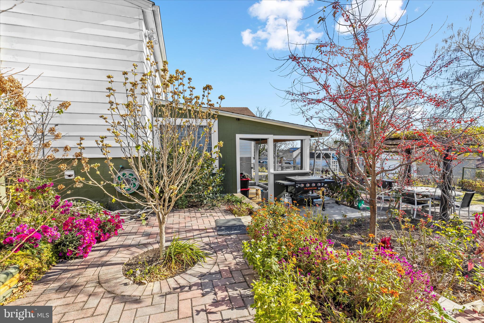 2813 Oak Grove Avenue Halethorpe, MD 21227 - Photo 32 of 43 a front view of a house with a yard and fountain in middle