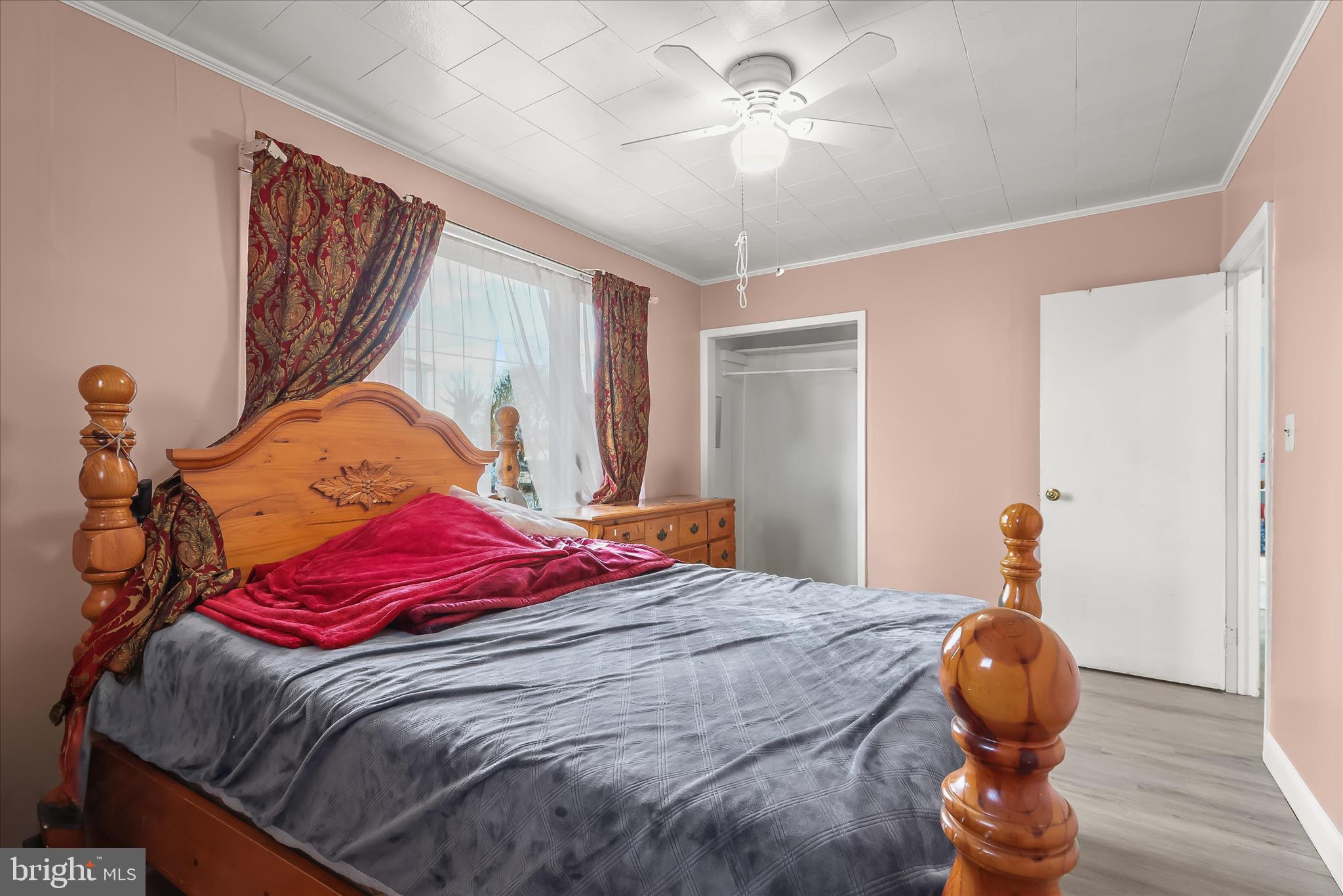 2813 Oak Grove Avenue Halethorpe, MD 21227 - Photo 5 of 43 a bedroom with a bed and a chandelier