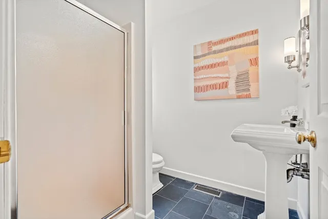 a bathroom with a sink and toilet