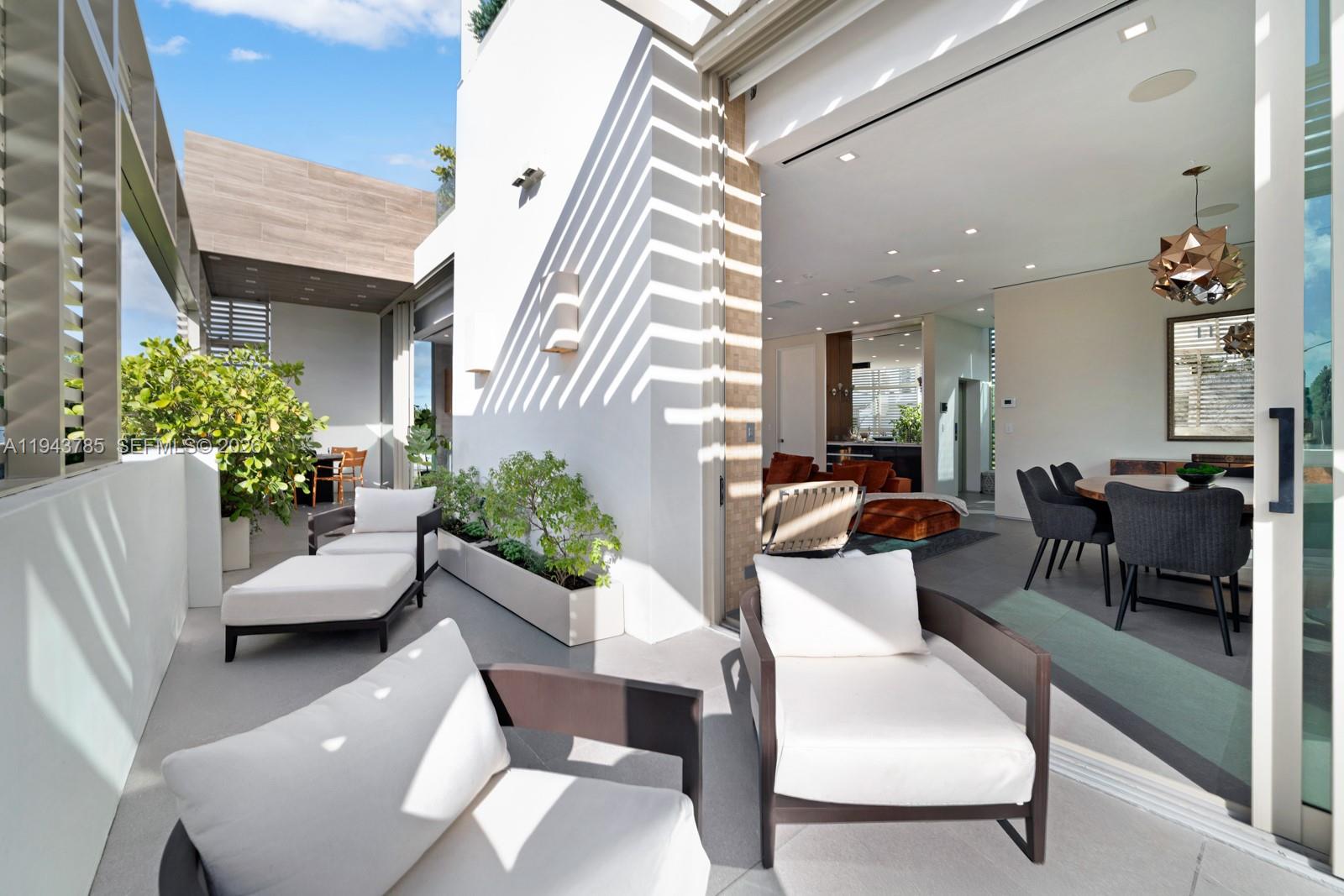 819 2nd Street Miami Beach, FL 33139 - Photo 11 of 32 a living room with furniture and a potted plant