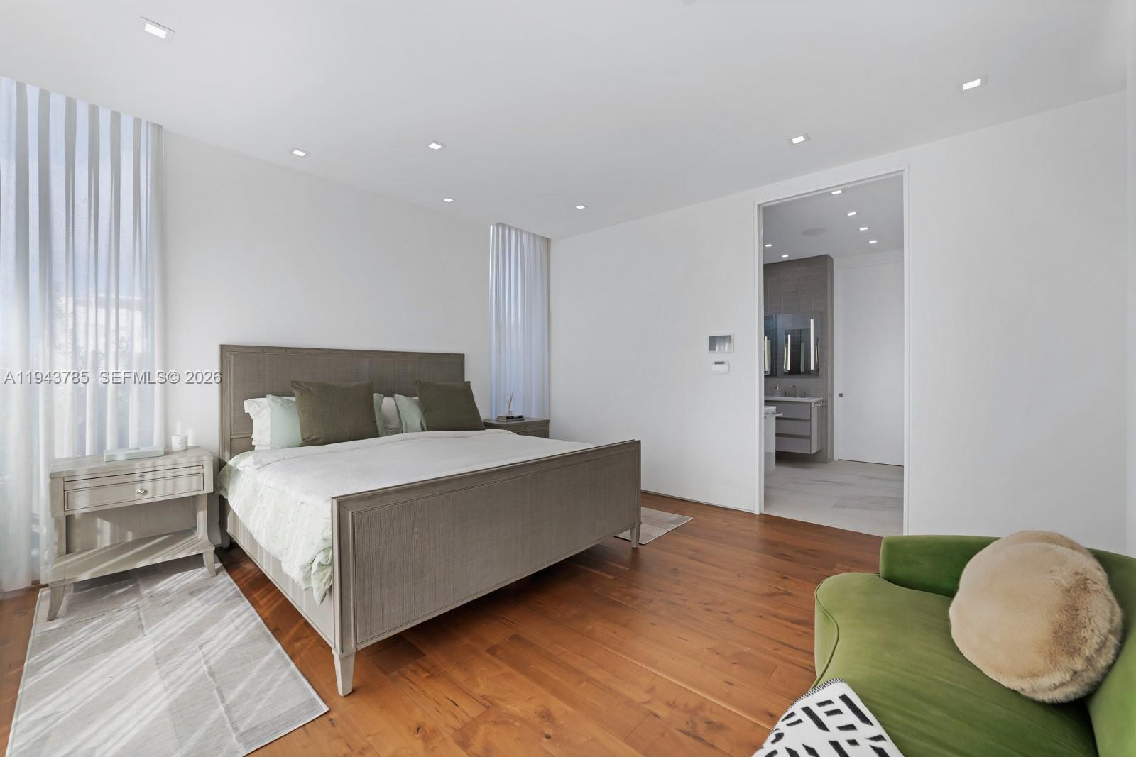 819 2nd Street Miami Beach, FL 33139 - Photo 16 of 32 a spacious bedroom with a bed and a couch