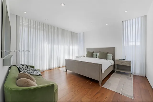 a bedroom with a bed and a couch