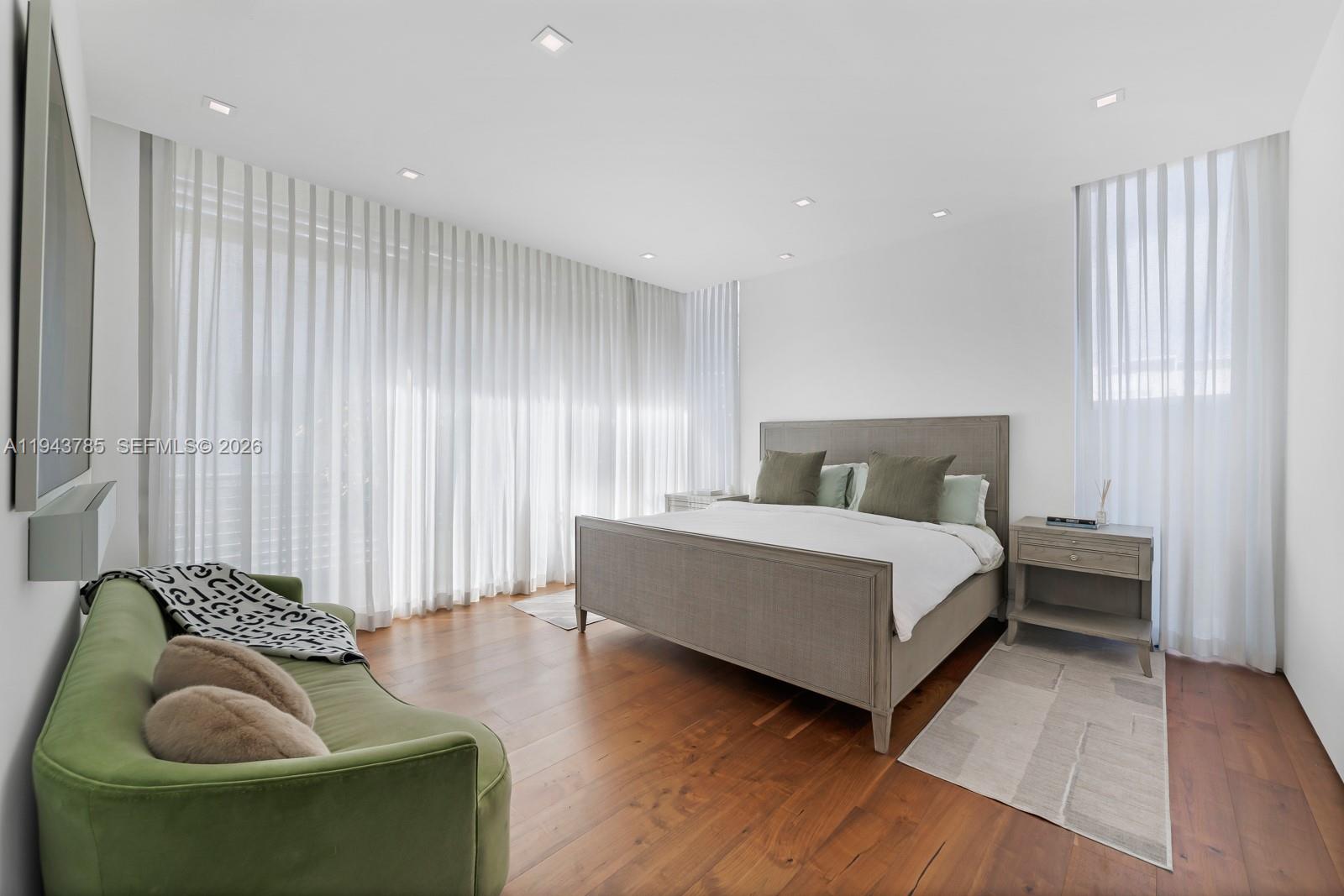 819 2nd Street Miami Beach, FL 33139 - Photo 17 of 32 a bedroom with a bed and a couch