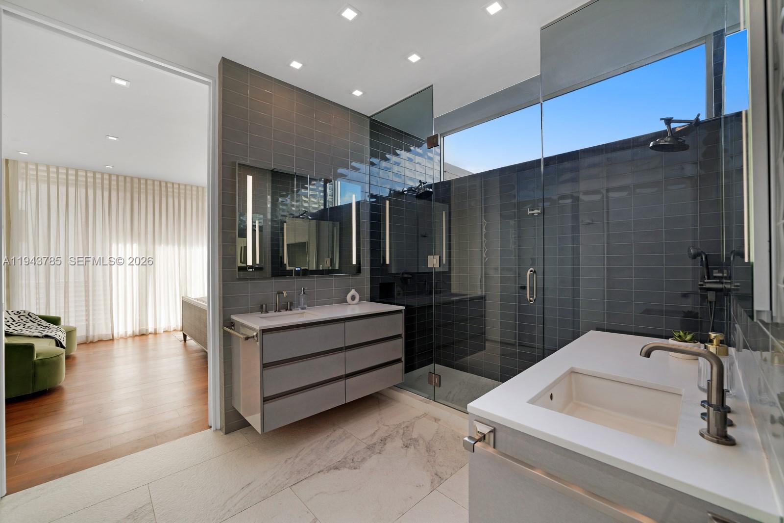 819 2nd Street Miami Beach, FL 33139 - Photo 19 of 32 a bathroom with a tub sink and mirror