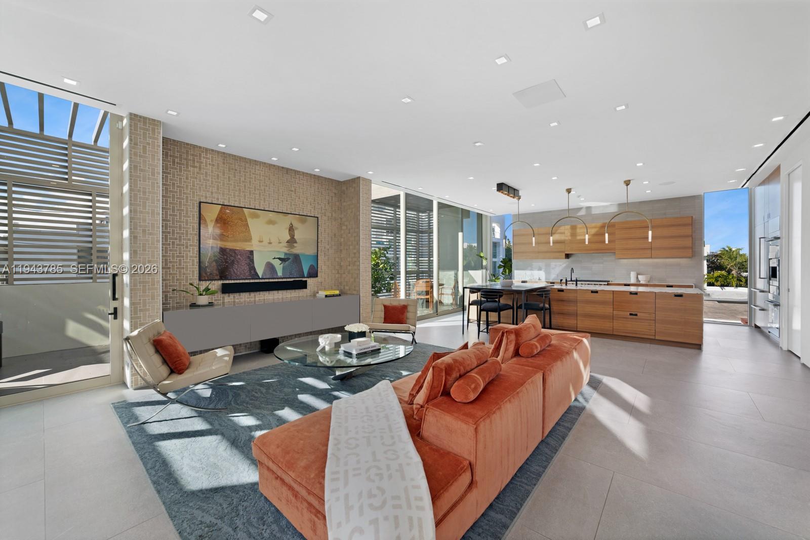 819 2nd Street Miami Beach, FL 33139 - Photo 2 of 32 a living room with furniture and a large window
