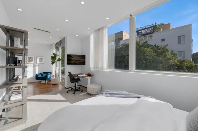 a room with furniture window and a flat screen tv