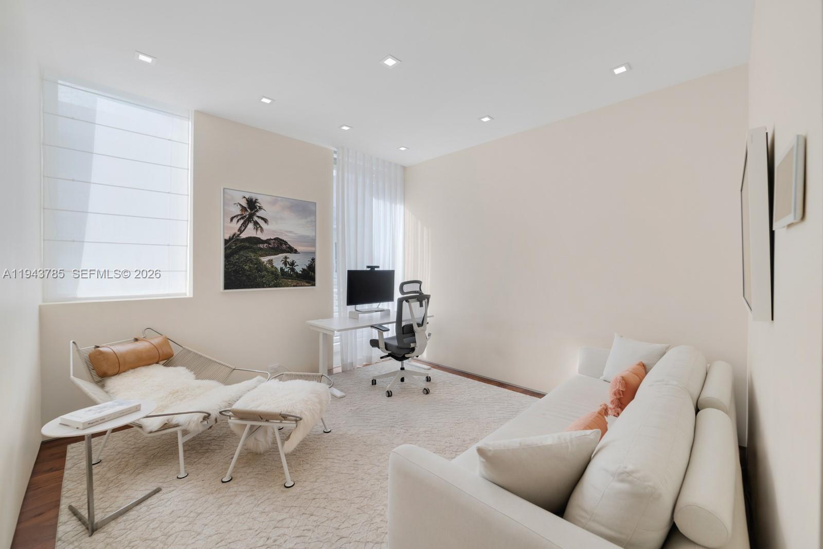 819 2nd Street Miami Beach, FL 33139 - Photo 23 of 32 a living room with furniture and a table