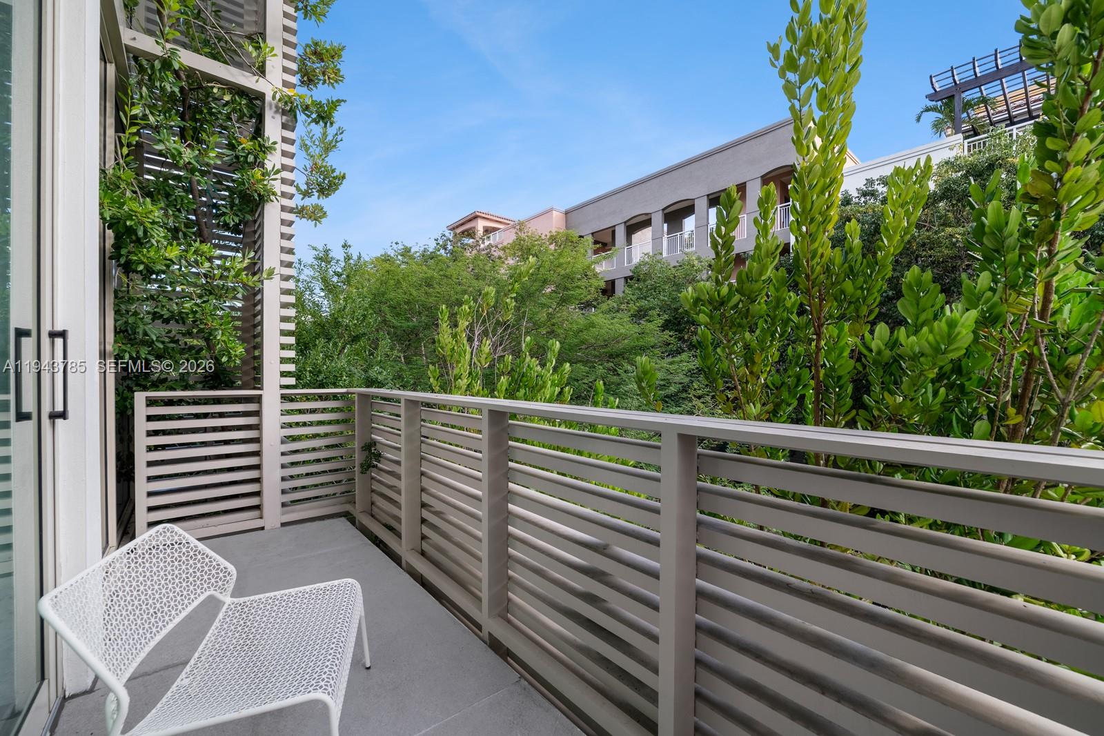 819 2nd Street Miami Beach, FL 33139 - Photo 25 of 32 a view of a chair and table in the balcony