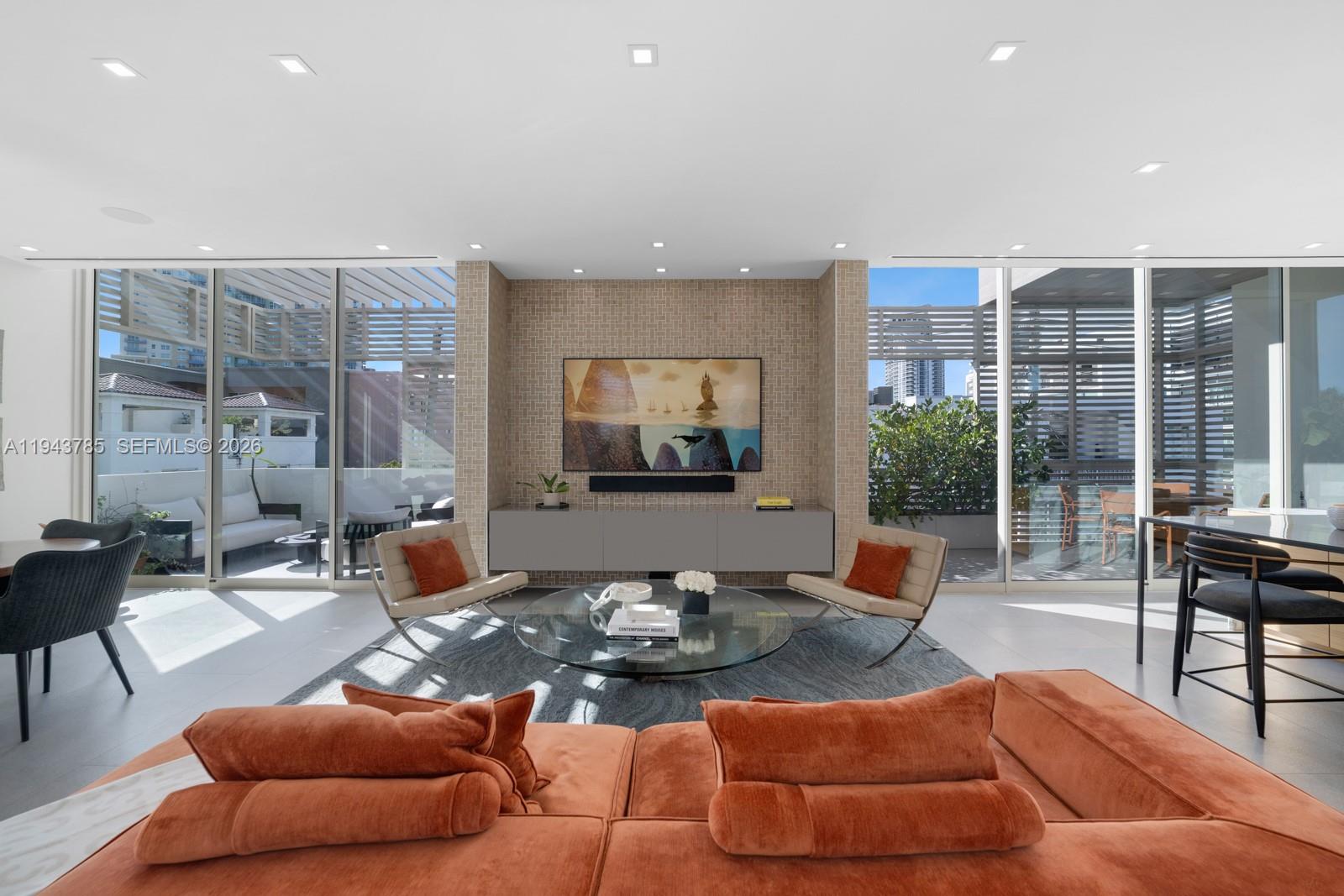 819 2nd Street Miami Beach, FL 33139 - Photo 3 of 32 a living room with furniture and a large window