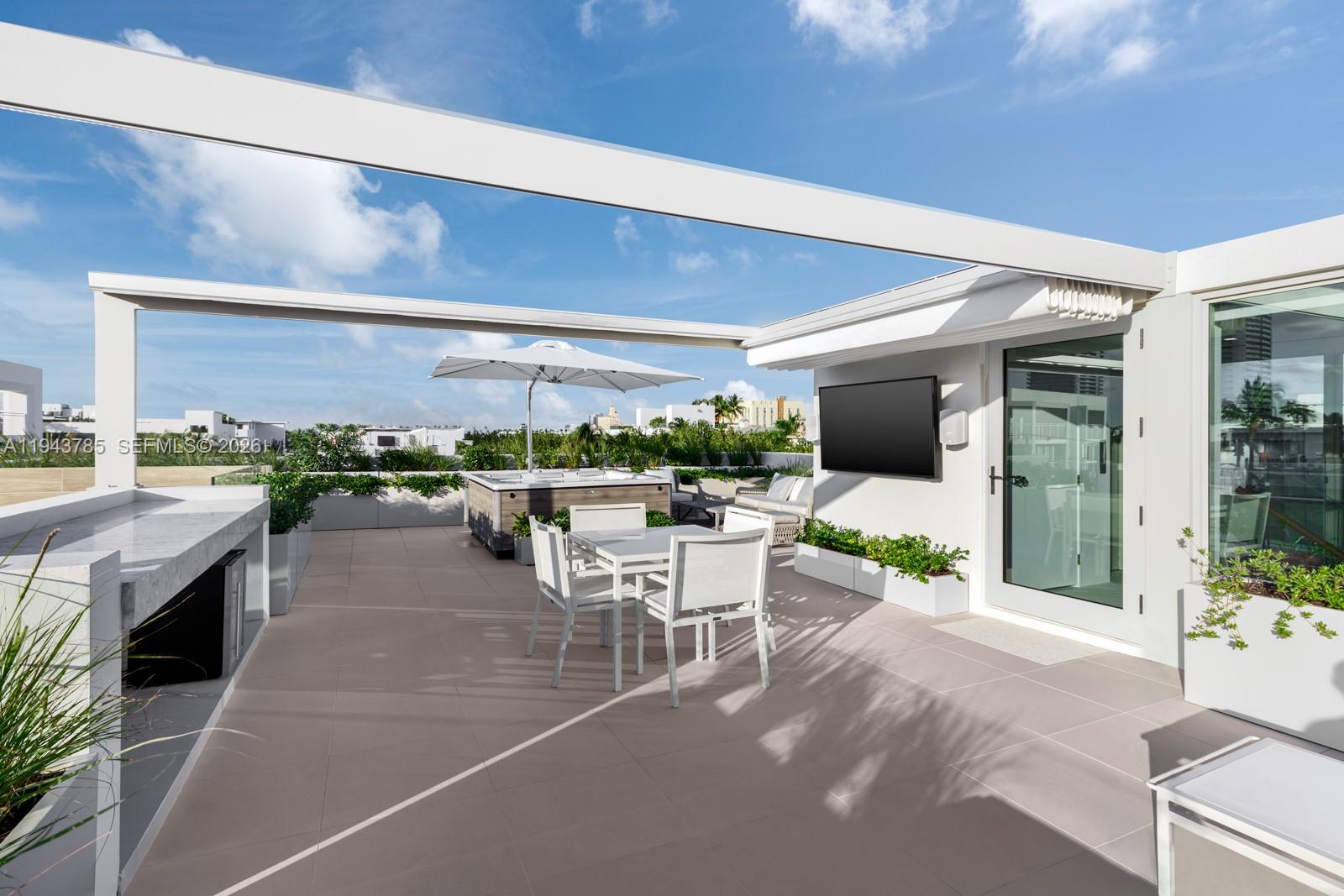 819 2nd Street Miami Beach, FL 33139 - Photo 31 of 32 a outdoor space with lots of table and chairs