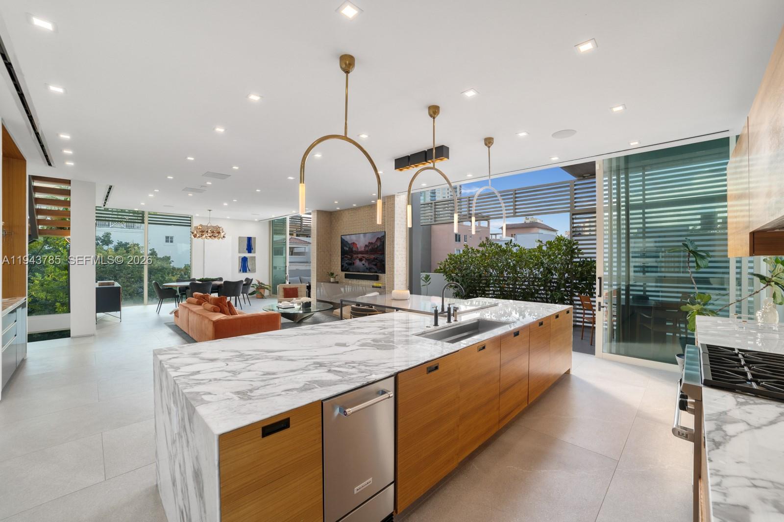 819 2nd Street Miami Beach, FL 33139 - Photo 7 of 32 a view of living room with granite countertop kitchen island furniture and a chandelier