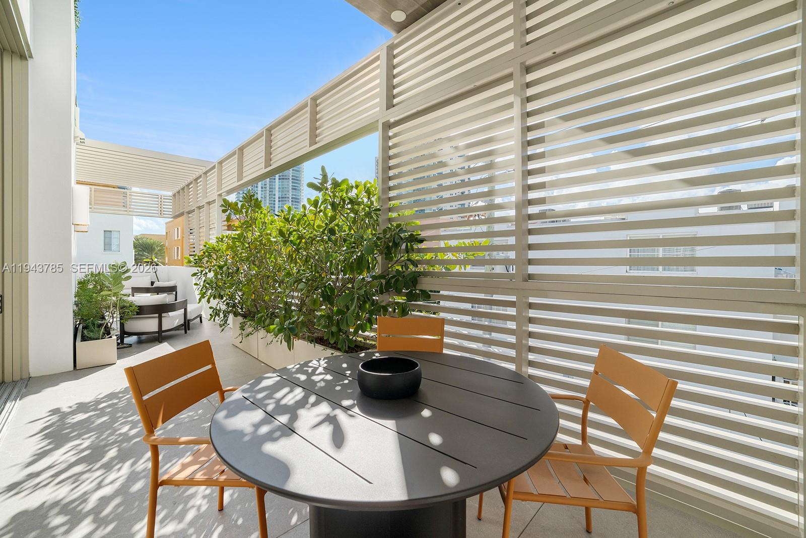 819 2nd Street Miami Beach, FL 33139 - Photo 10 of 32 a backyard of a house with seating space