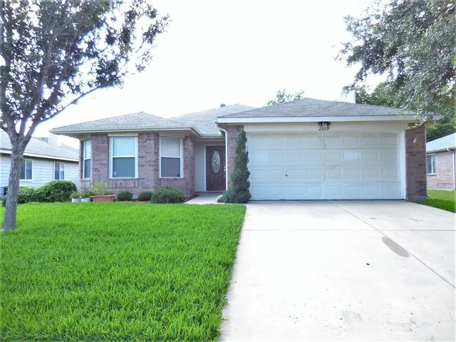 a view of a house with a garden