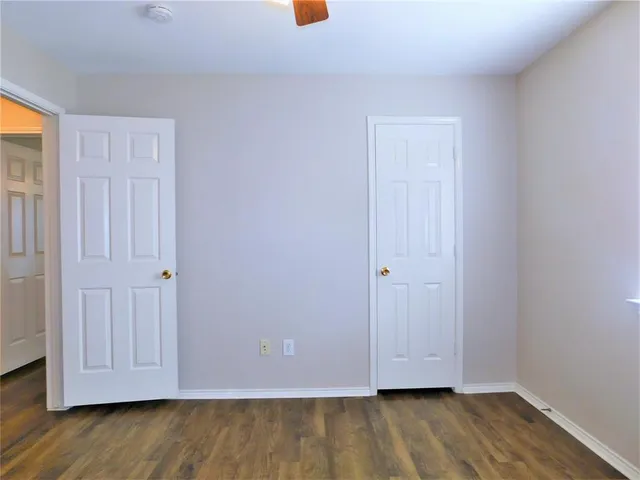 a view of room with wooden floor