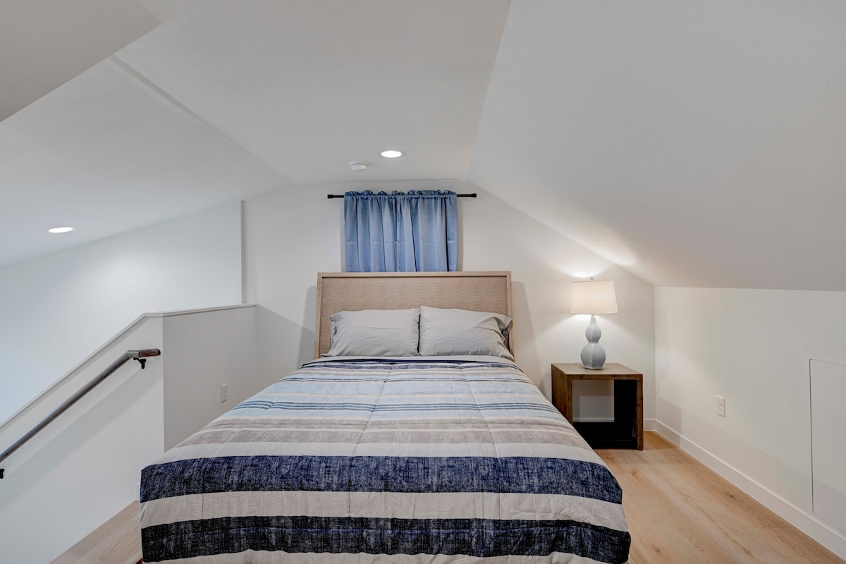 2220 Yellow Jacket Lane, Unit 1 Austin, TX 78741 - Photo 28 of 35 A cozy bedroom with slanted ceilings and recessed lighting provides a quiet, elevated retreat.