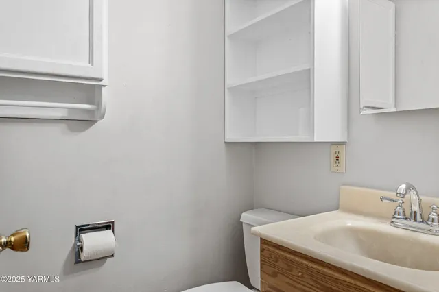 a bedroom with a bed and cabinets