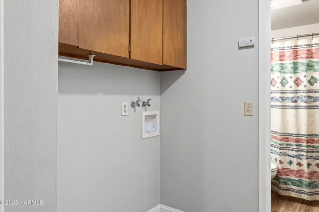 a bathroom with a sink a toilet and shower curtain