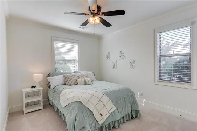a view of an empty room with a ceiling fan