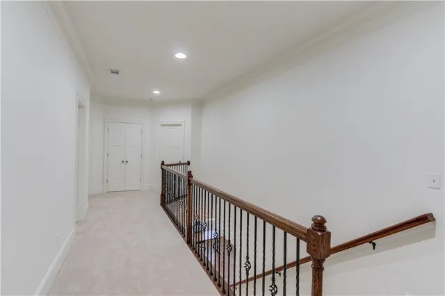 a spacious bedroom with a bed and a large window