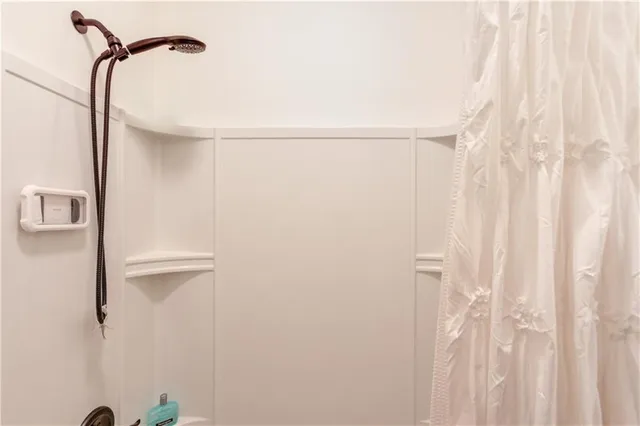 a bedroom with bed and window