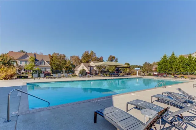 a view of a lake with houses in the back