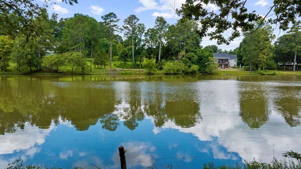 16280 Clarity Road Alpharetta, GA 30004 - Photo 12 of 13 a view of a lake with a yard