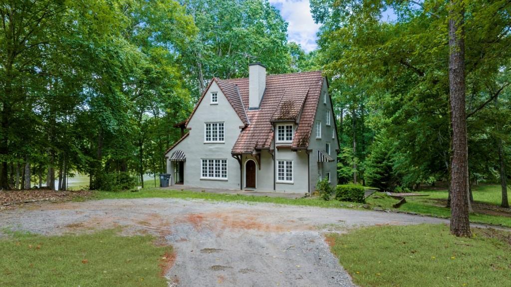 16280 Clarity Road Alpharetta, GA 30004 - Photo 13 of 13 a front view of a house with a garden