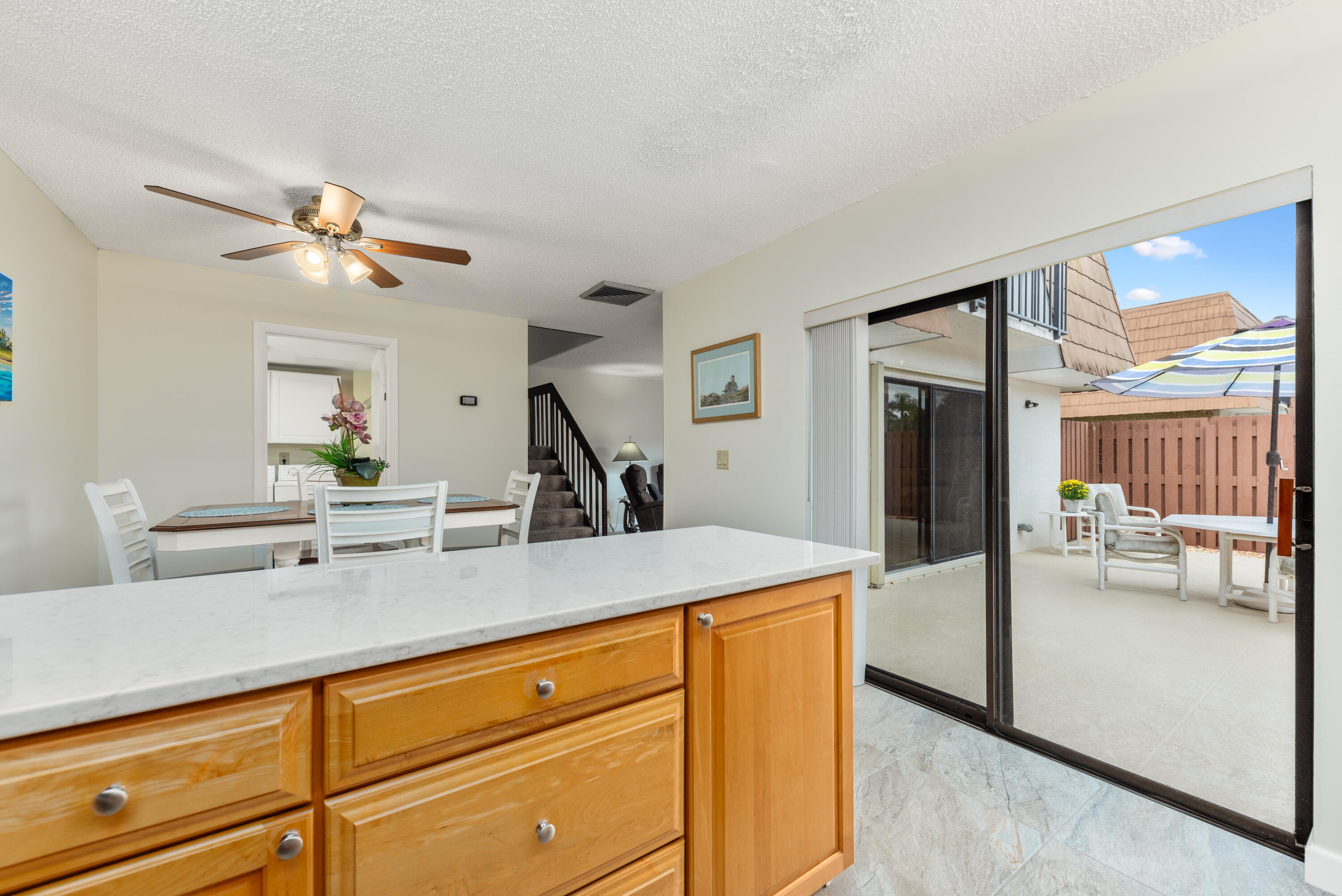 5874 Southeast Riverboat Drive, Unit 330 Stuart, FL 34997 - Photo 15 of 40 a kitchen with a refrigerator and a sink