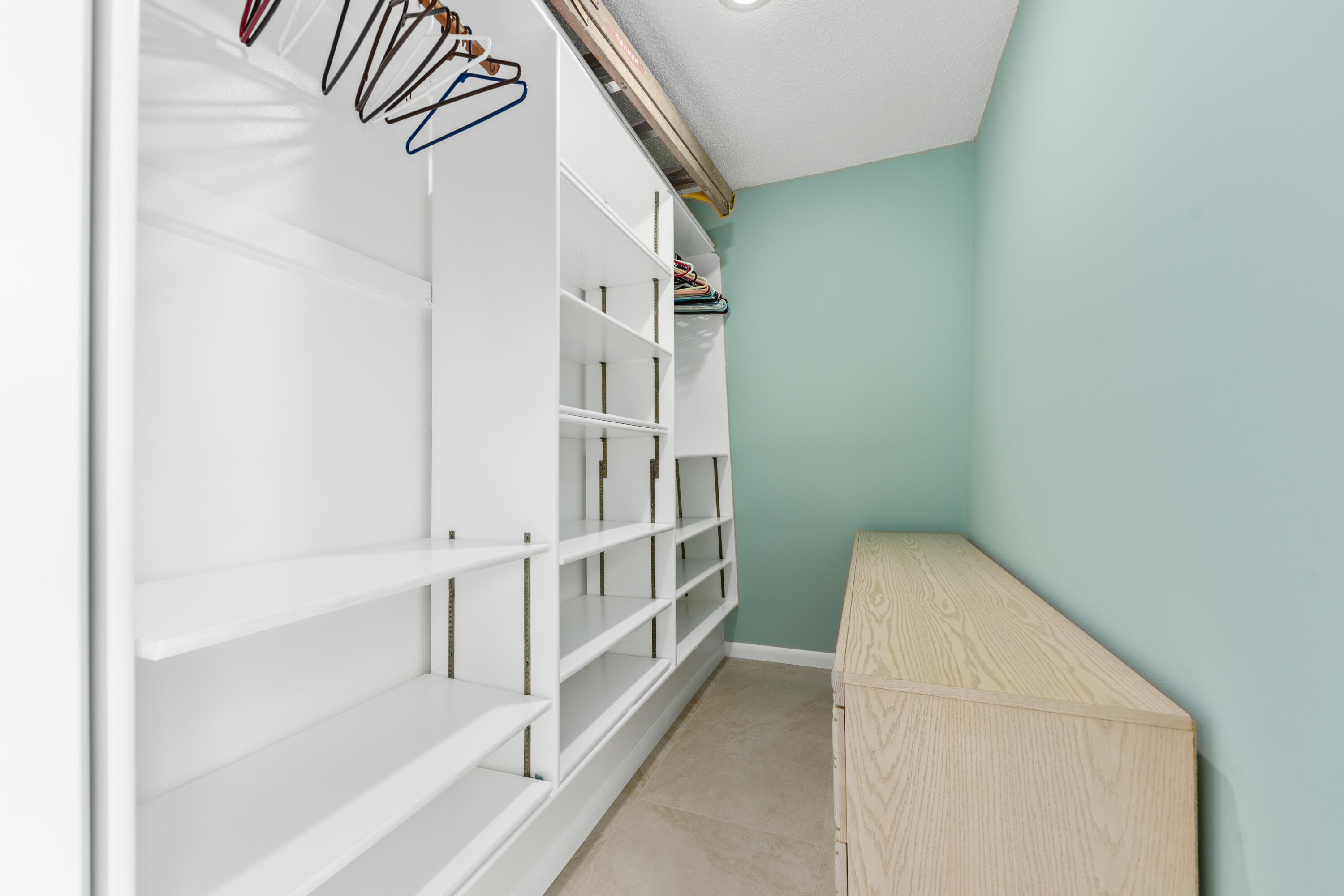 5874 Southeast Riverboat Drive, Unit 330 Stuart, FL 34997 - Photo 19 of 40 a view of staircase with white walls and white door