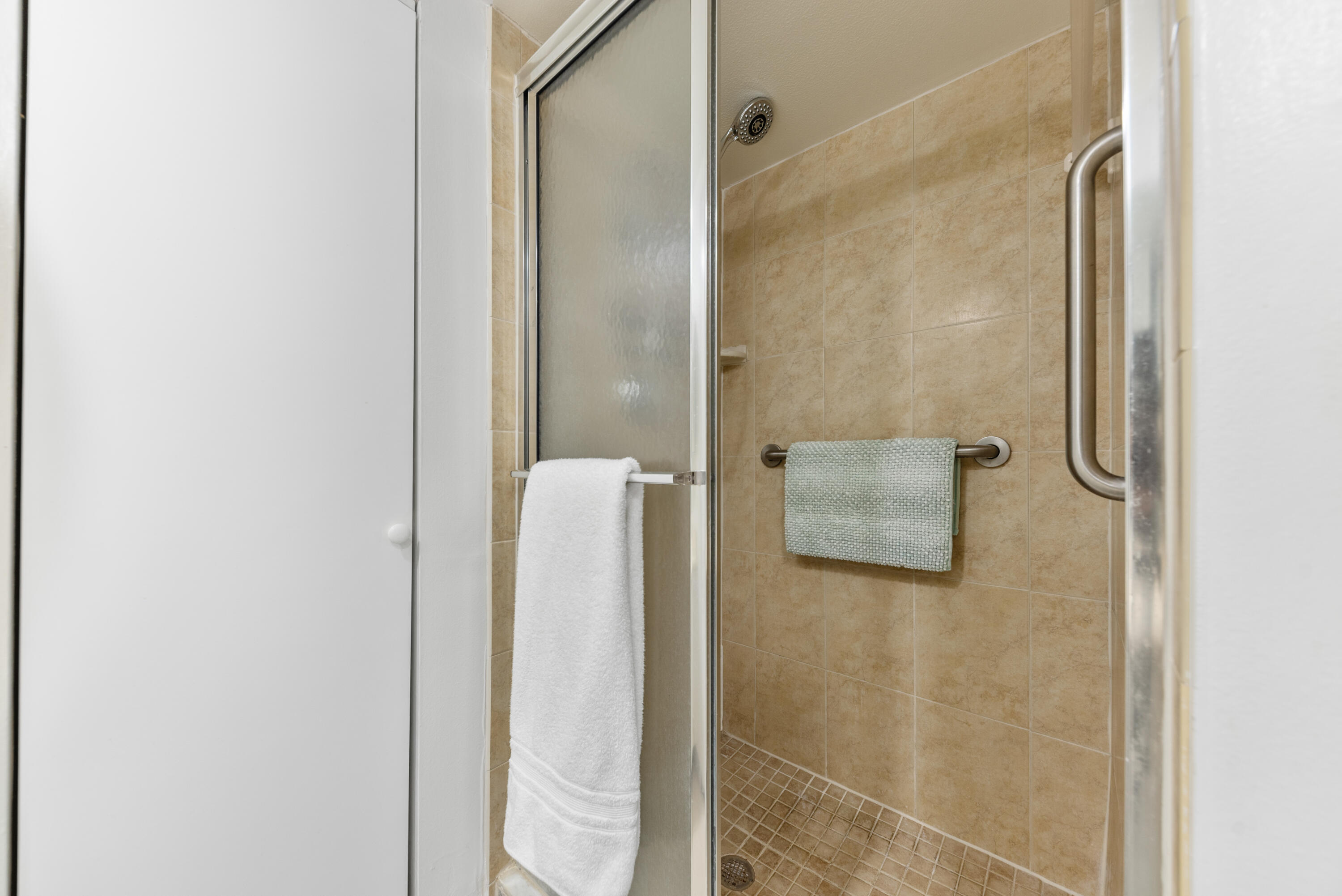 5874 Southeast Riverboat Drive, Unit 330 Stuart, FL 34997 - Photo 22 of 40 a bathroom with a shower and a sink
