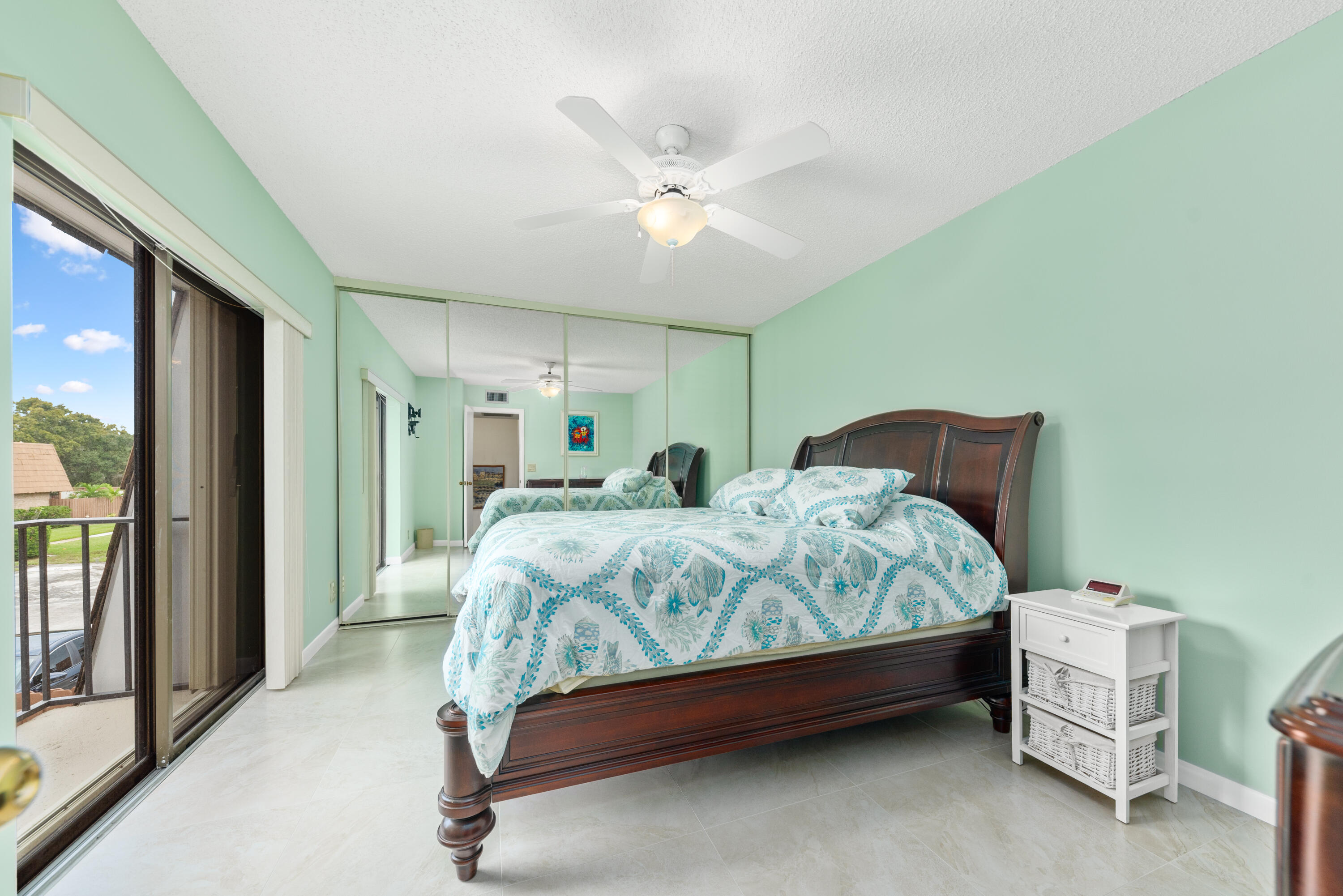 5874 Southeast Riverboat Drive, Unit 330 Stuart, FL 34997 - Photo 23 of 40 a bedroom with a bed and a window