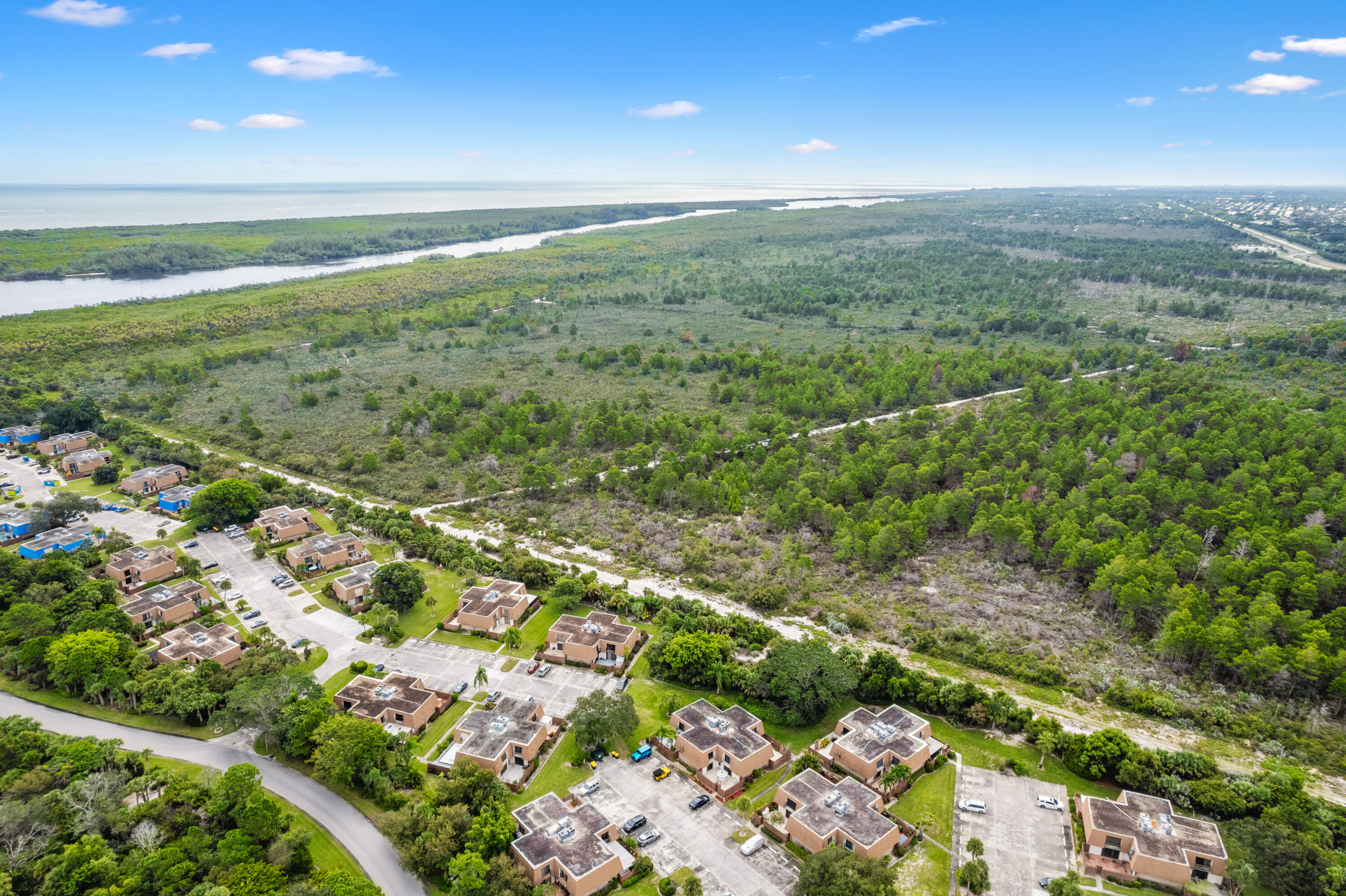 5874 Southeast Riverboat Drive, Unit 330 Stuart, FL 34997 - Photo 30 of 40 a view of an outdoor space and a lake view