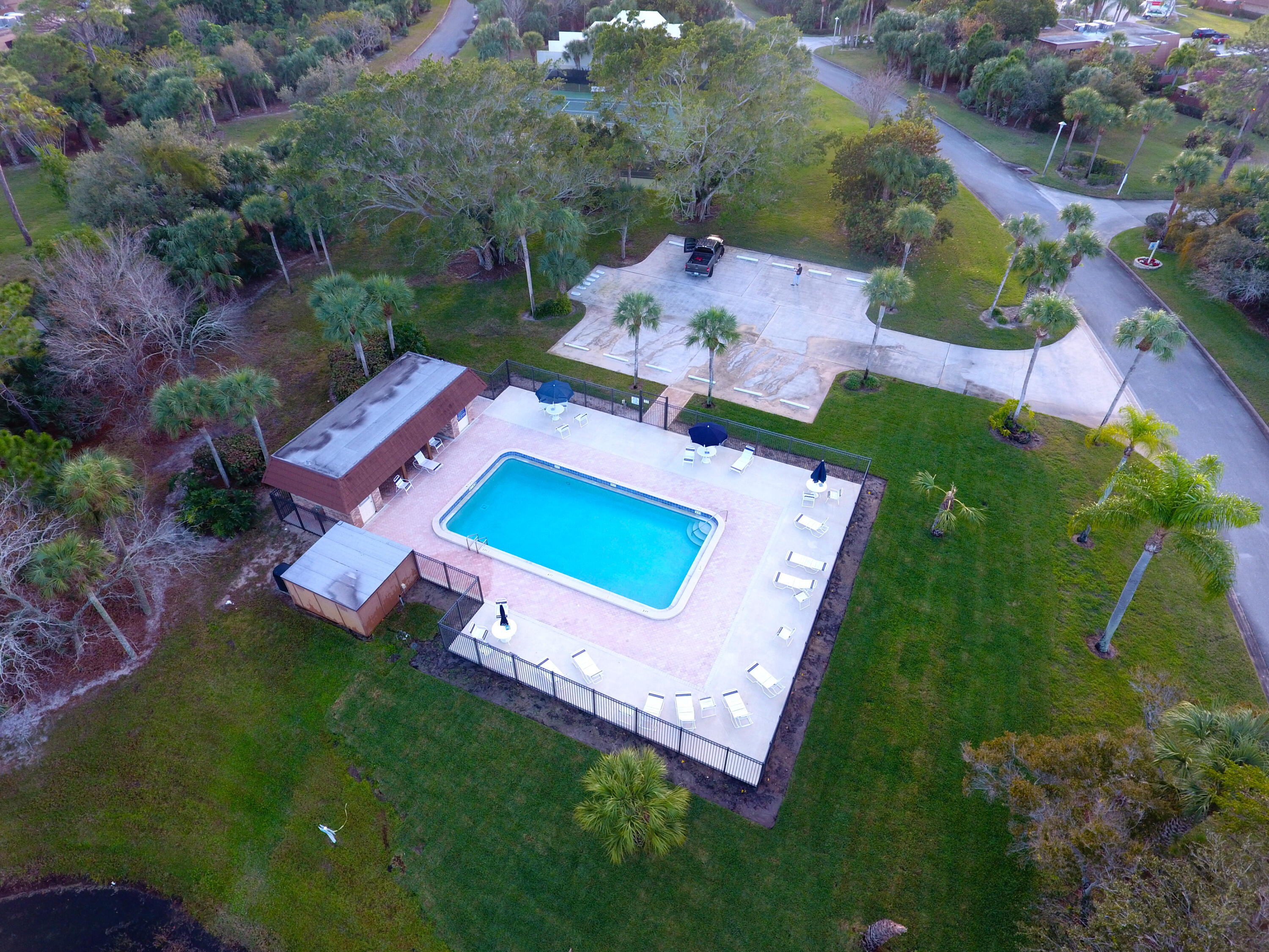 5874 Southeast Riverboat Drive, Unit 330 Stuart, FL 34997 - Photo 31 of 40 an aerial view of a house with garden space and street view