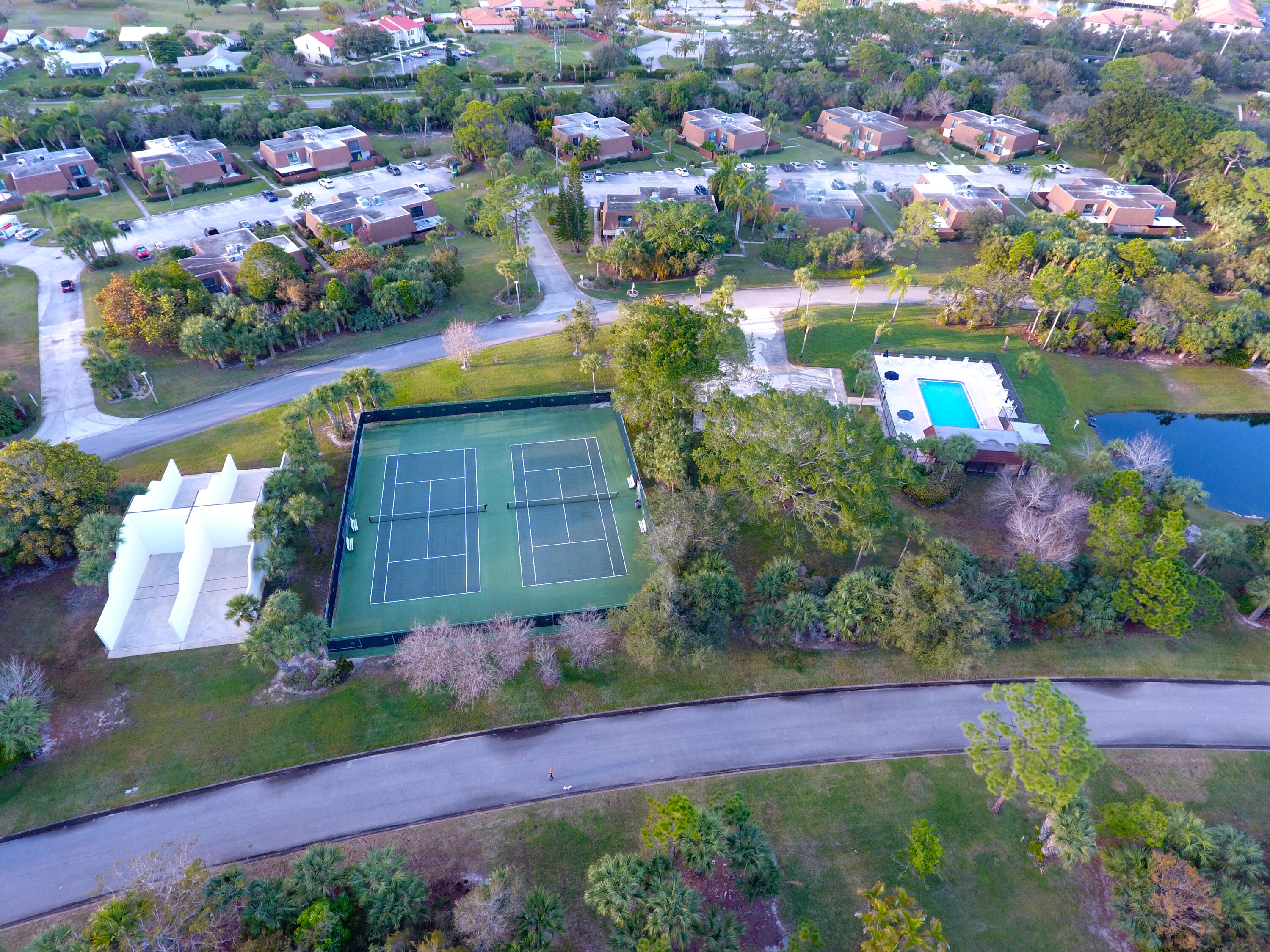 5874 Southeast Riverboat Drive, Unit 330 Stuart, FL 34997 - Photo 32 of 40 a view of yard and swimming pool