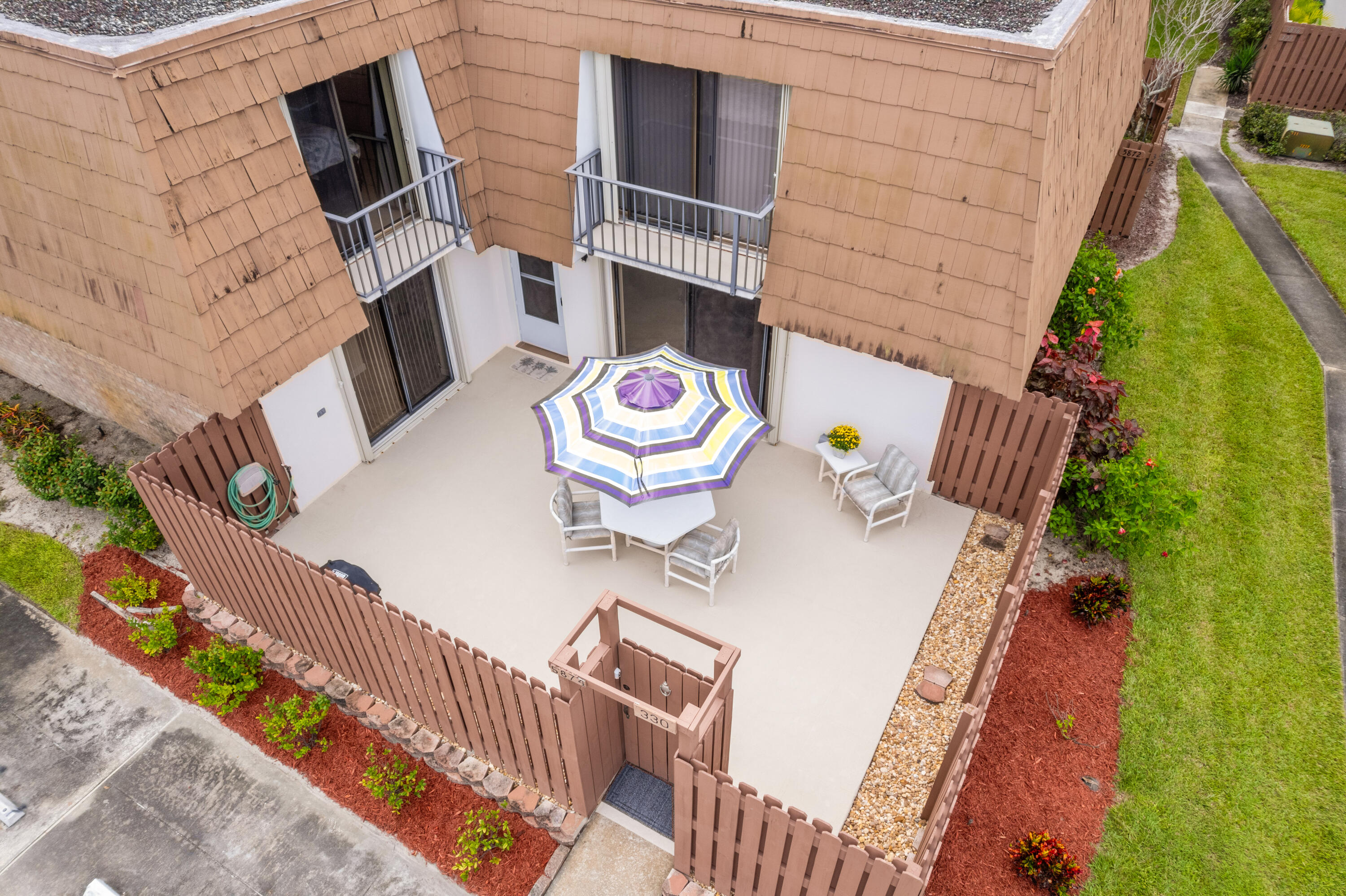 5874 Southeast Riverboat Drive, Unit 330 Stuart, FL 34997 - Photo 40 of 40 a view of deck and patio
