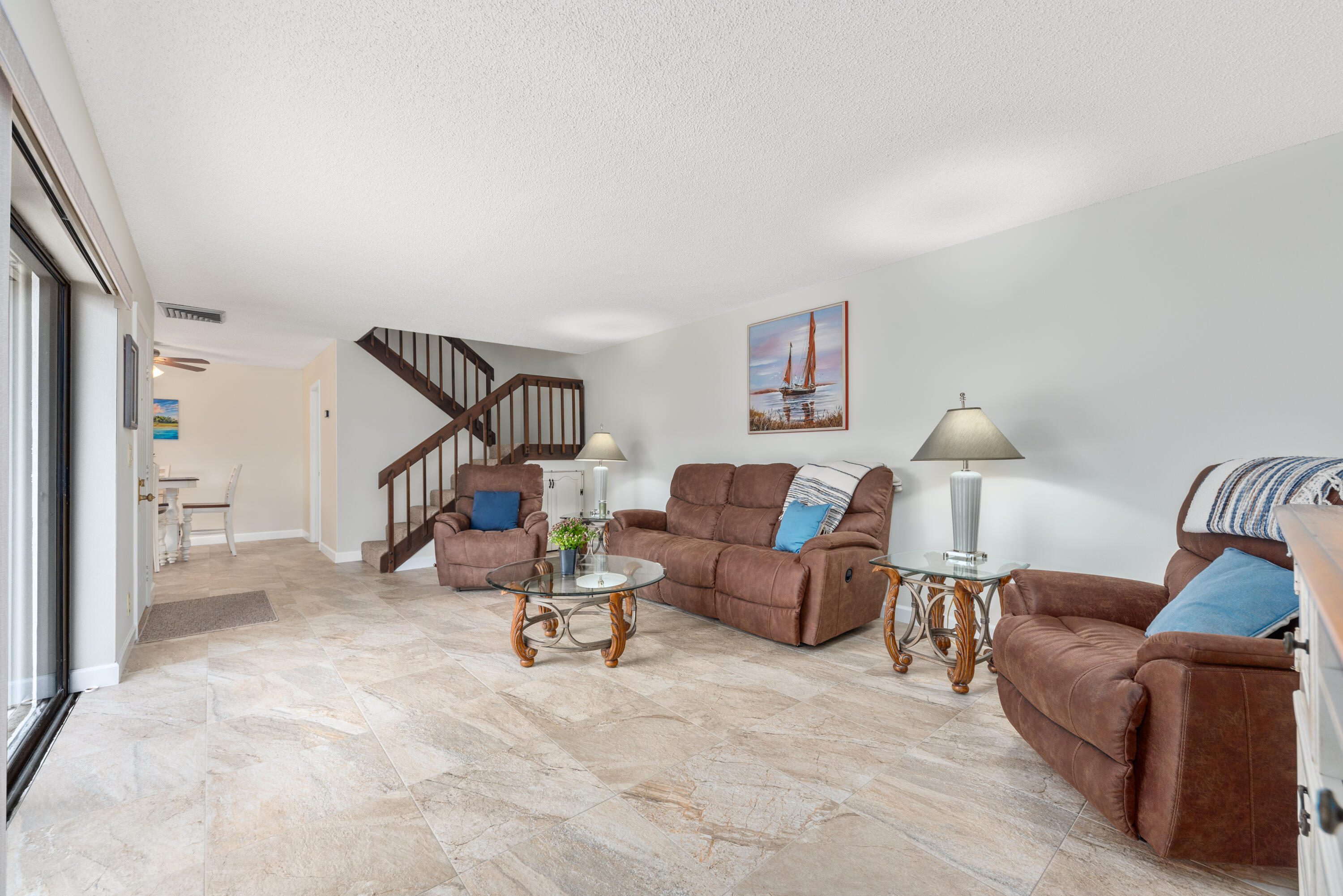 5874 Southeast Riverboat Drive, Unit 330 Stuart, FL 34997 - Photo 8 of 40 a view of a livingroom with furniture and a couch