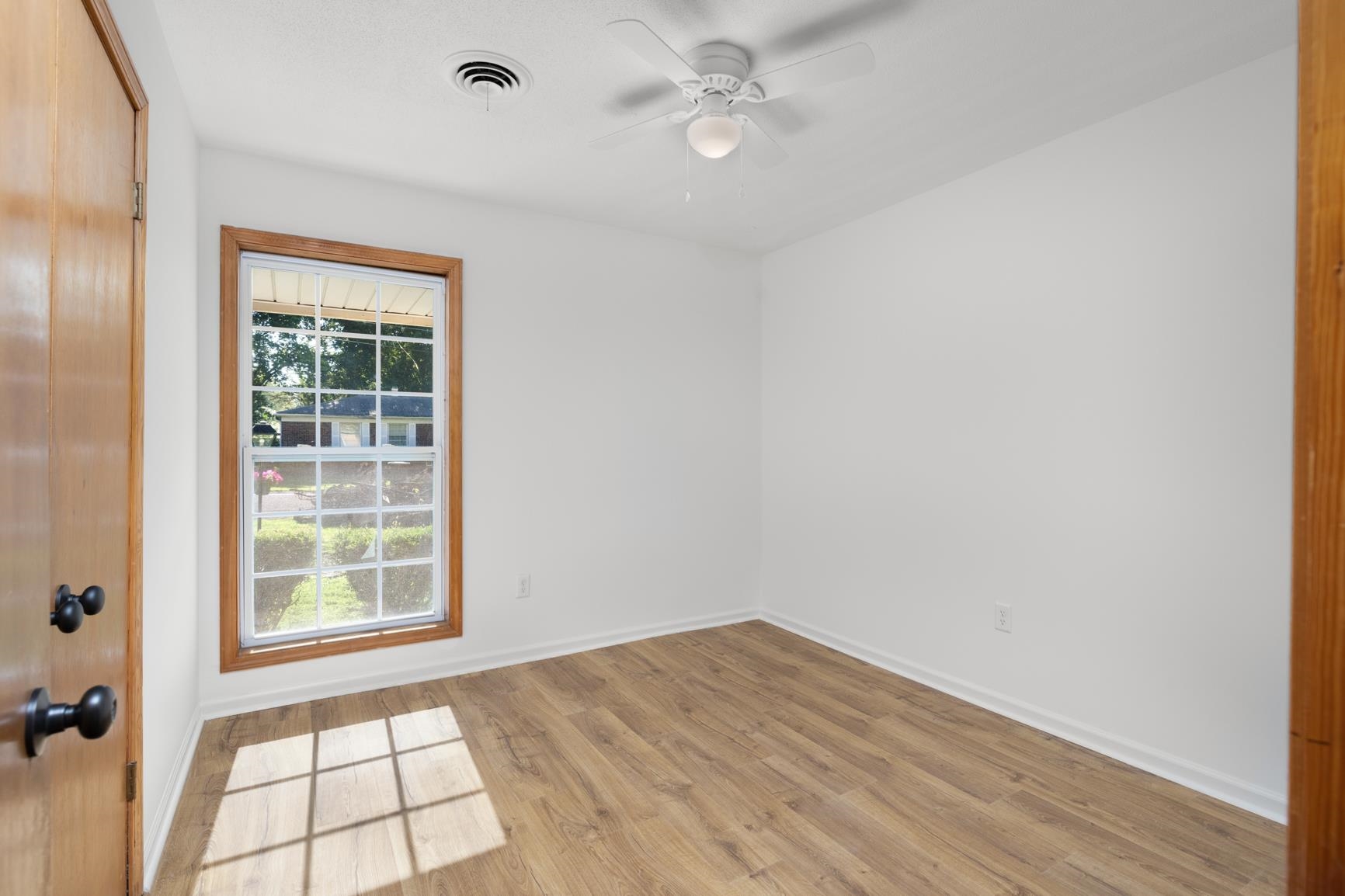 426 Homeville Road Collierville, TN 38017 - Photo 16 of 23 wooden floor in an empty room with a window