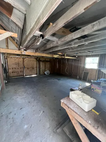a utility room with furniture and a sink