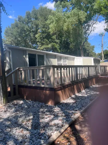 a view of a deck with a yard