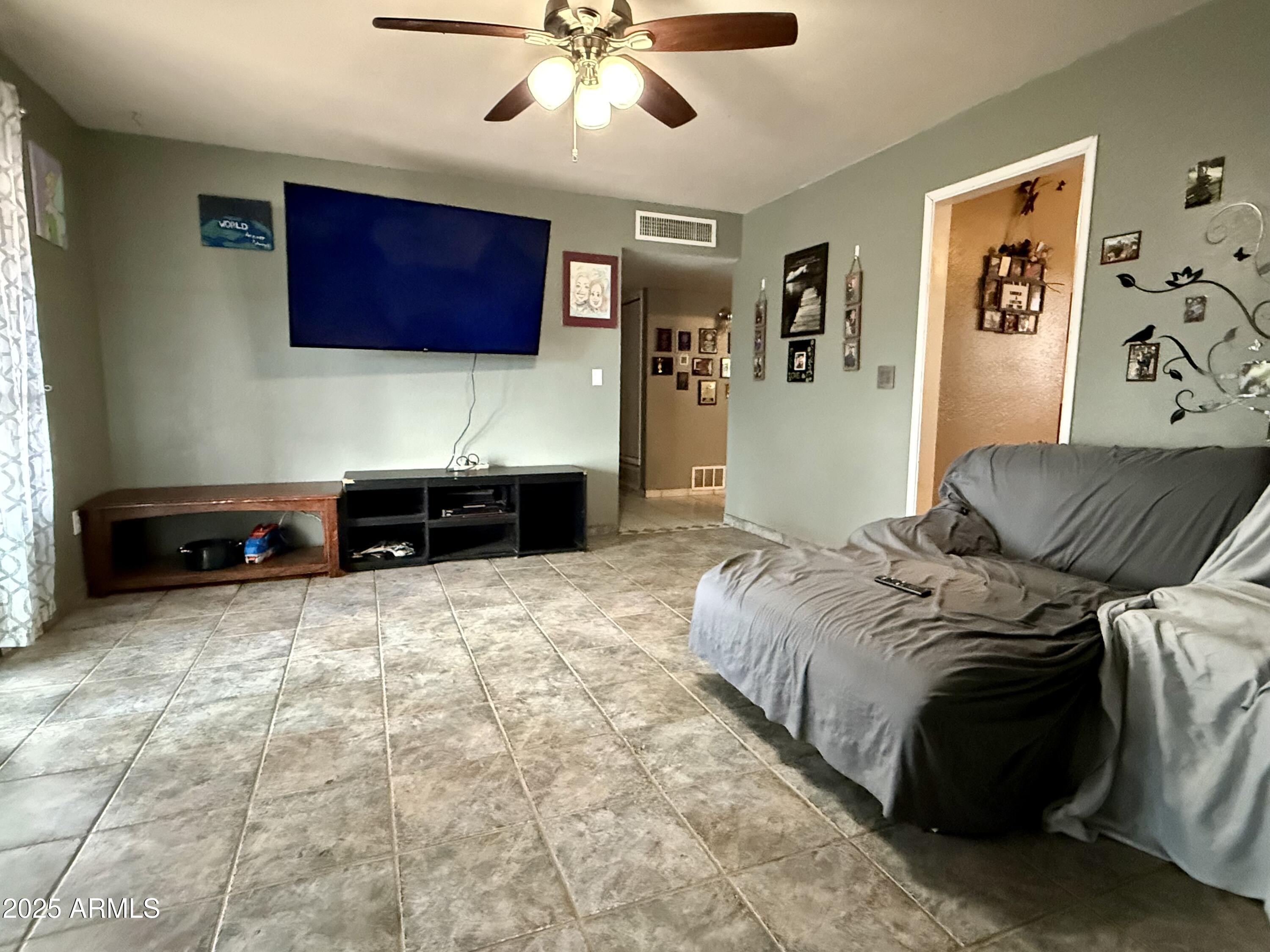 2535 East Roadrunner Ridge Tombstone, AZ 85638 - Photo 11 of 20 a bedroom with a bed and a couch