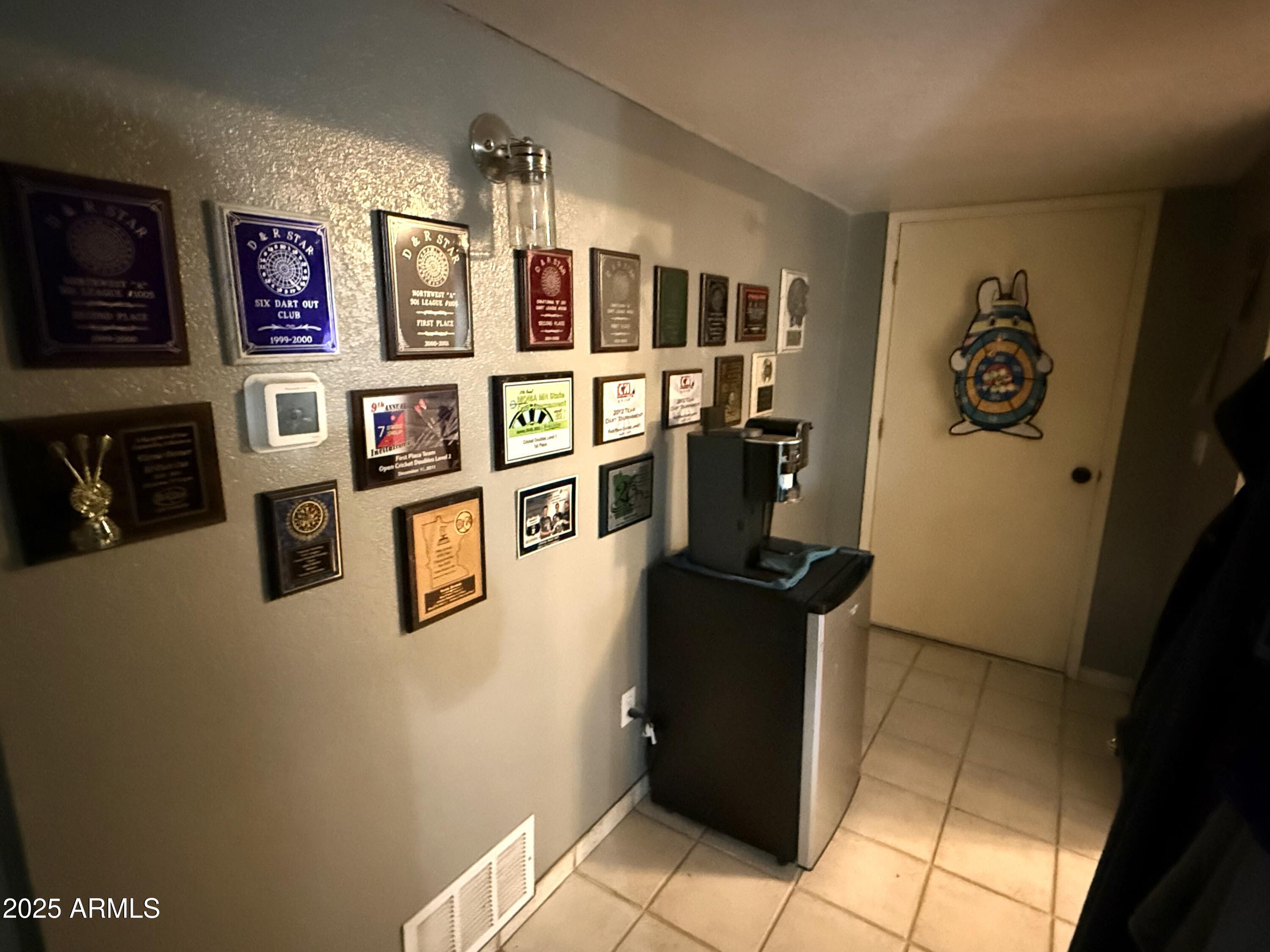 2535 East Roadrunner Ridge Tombstone, AZ 85638 - Photo 12 of 20 a view of a kitchen with fridge and workspace
