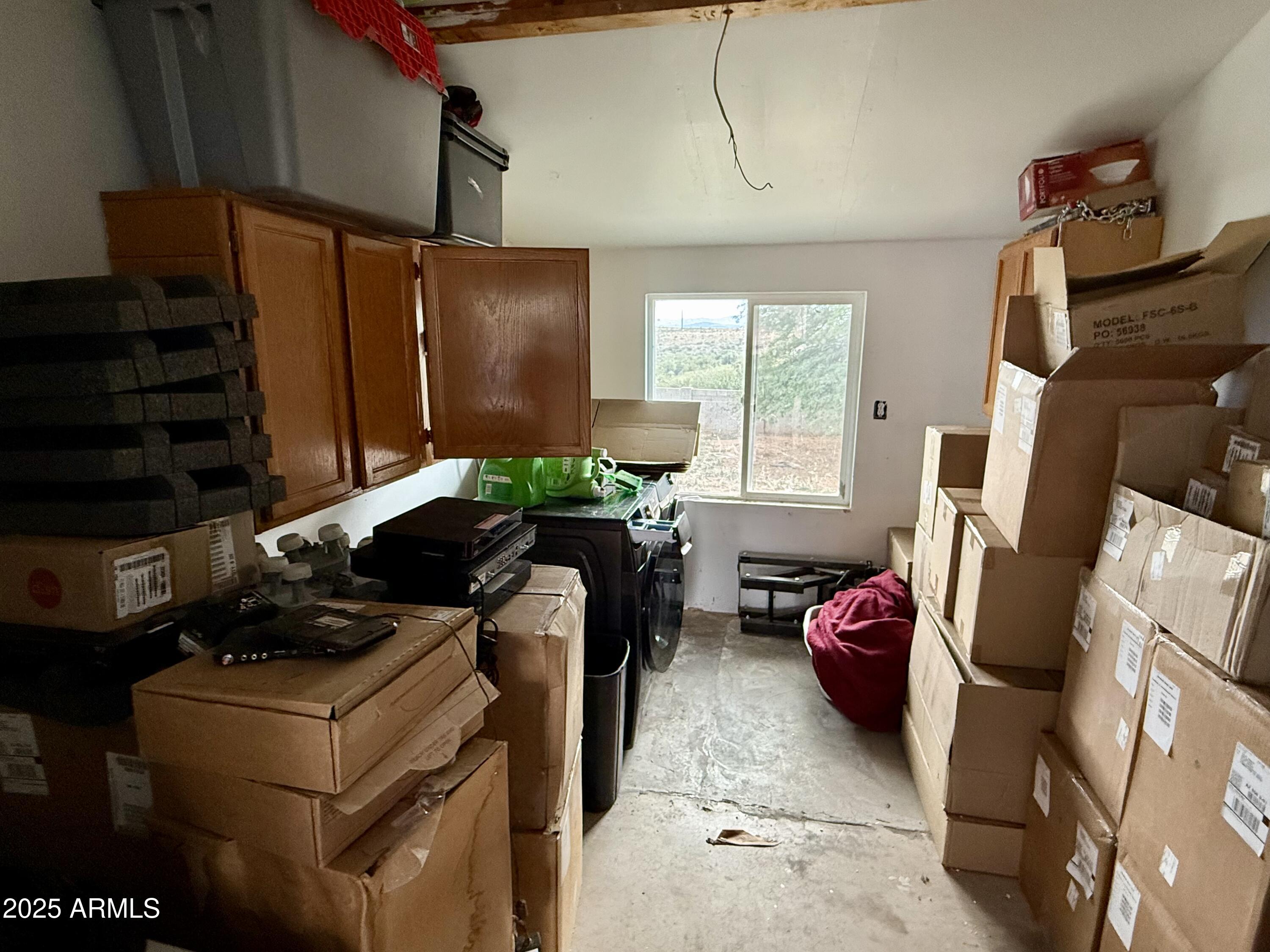 2535 East Roadrunner Ridge Tombstone, AZ 85638 - Photo 19 of 20 a room with furniture and a flat screen tv