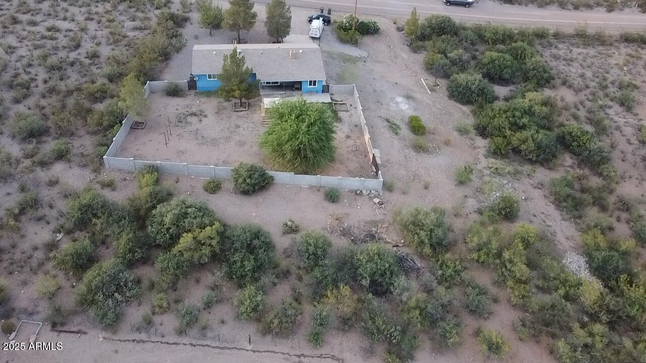2535 East Roadrunner Ridge Tombstone, AZ 85638 - Photo 3 of 20 an aerial view of a house with a yard
