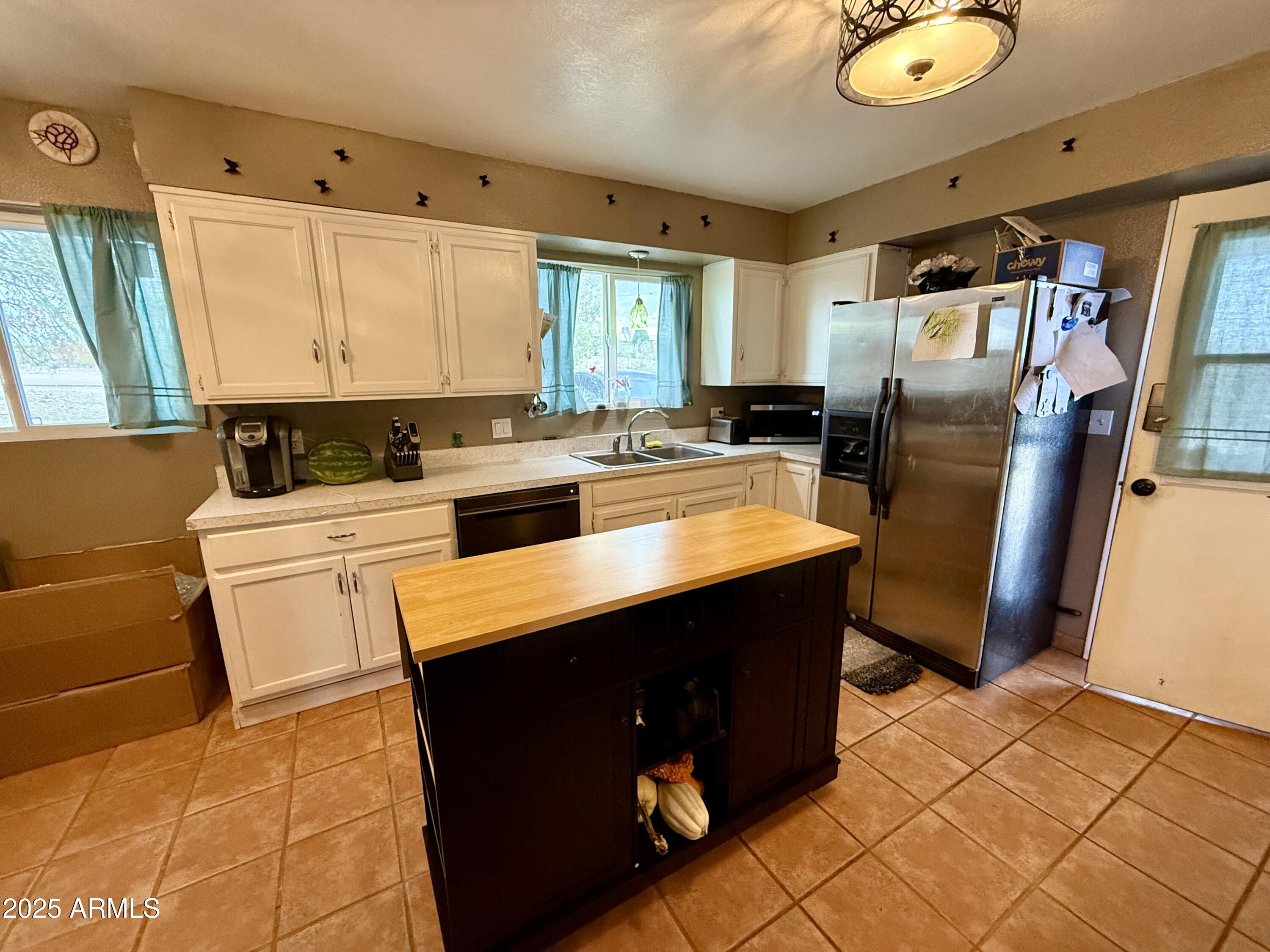 2535 East Roadrunner Ridge Tombstone, AZ 85638 - Photo 6 of 20 a kitchen with a sink appliances and cabinets