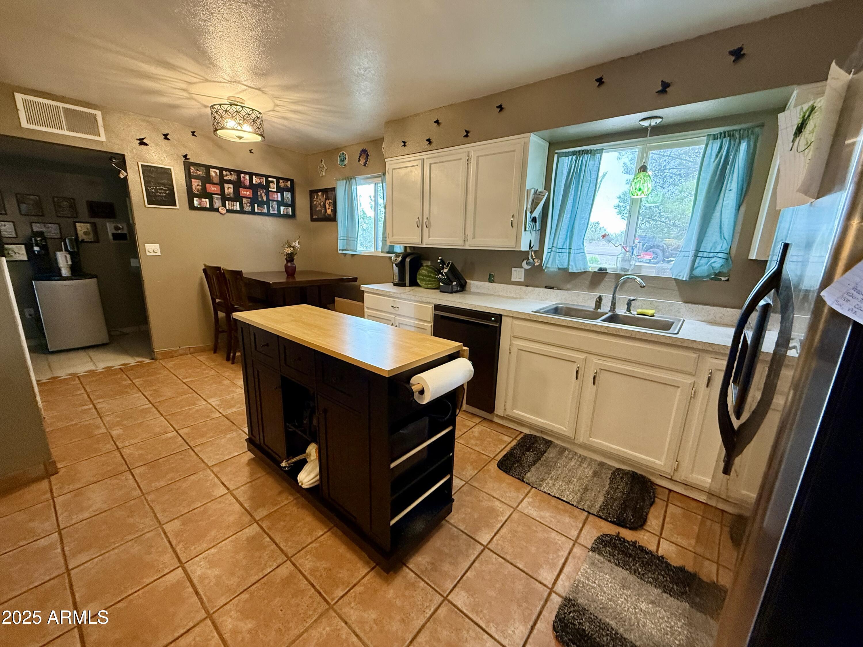 2535 East Roadrunner Ridge Tombstone, AZ 85638 - Photo 7 of 20 a kitchen with a sink appliances and cabinets