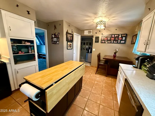 a room with pool table and flat screen tv