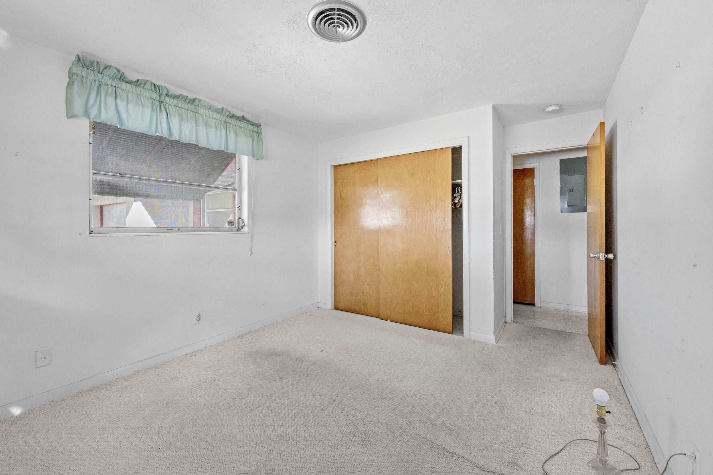 490 West 31st Street Riviera Beach, FL 33404 - Photo 16 of 29 an empty room with windows and closet