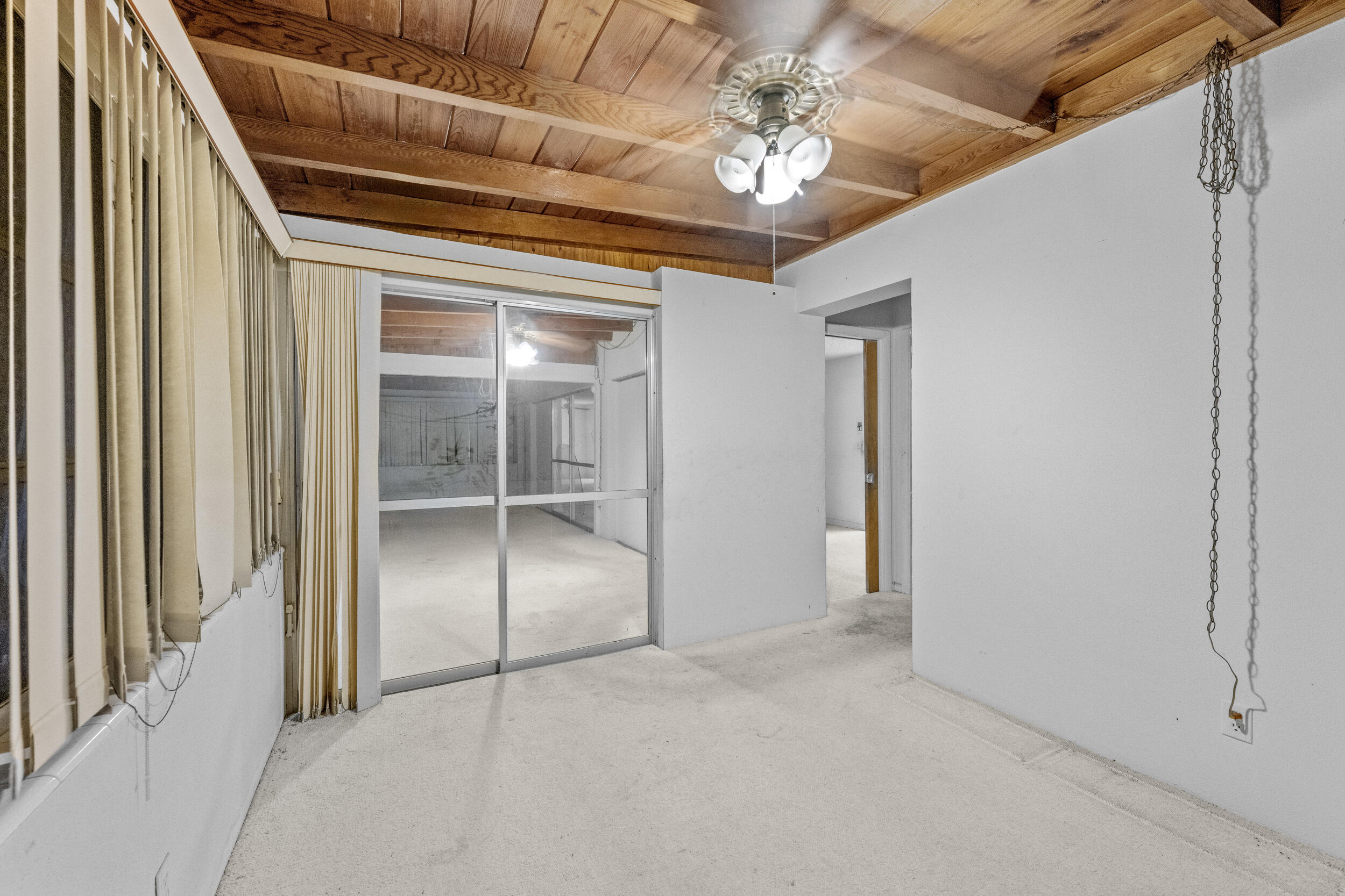 490 West 31st Street Riviera Beach, FL 33404 - Photo 19 of 29 a view of a hallway with a chandelier