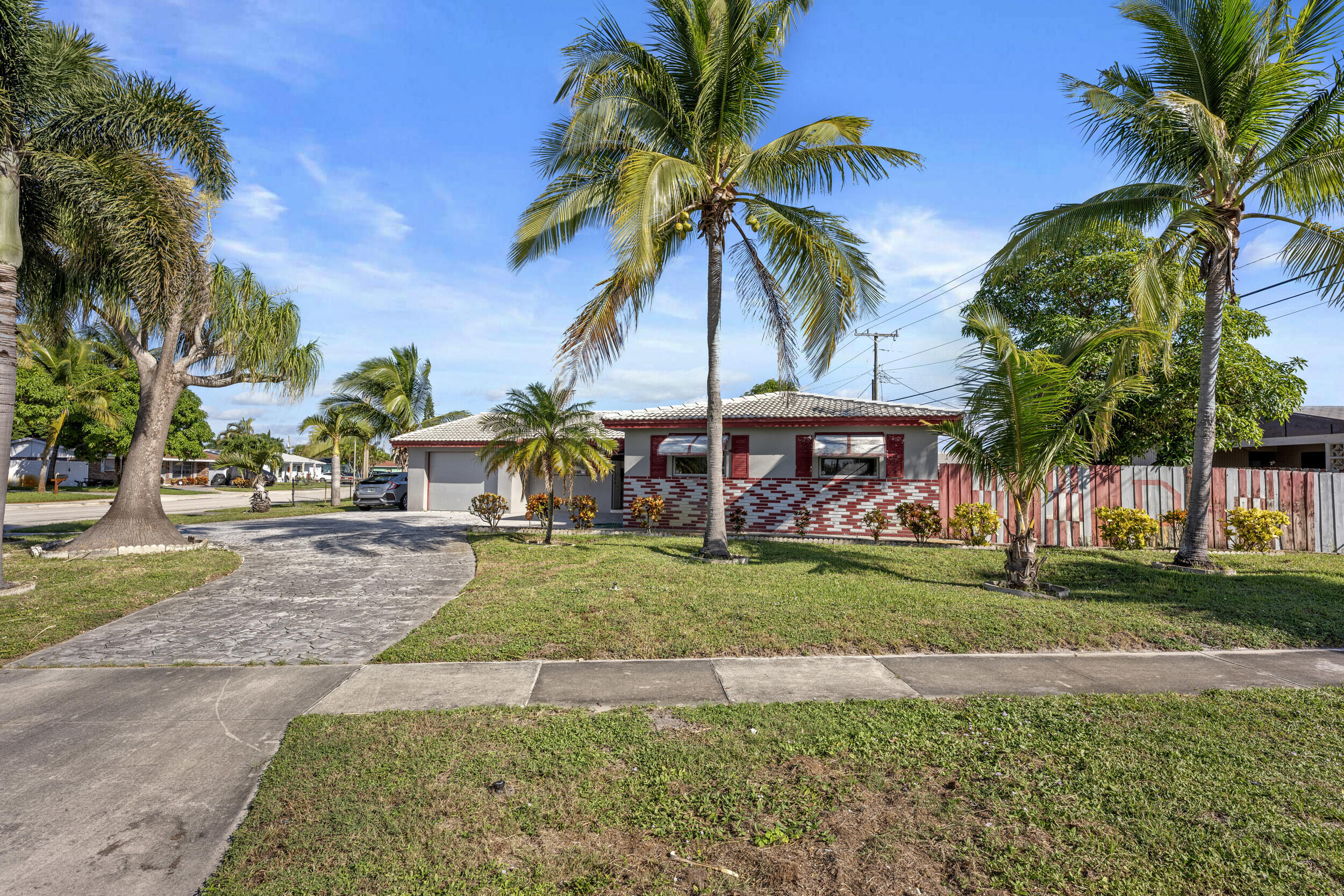 490 West 31st Street Riviera Beach, FL 33404 - Photo 2 of 29 a view of a yard and front view of a house